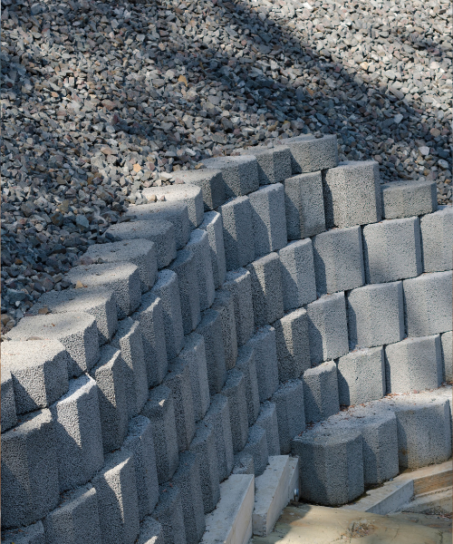 A pile of cement blocks sitting on top of a pile of gravel