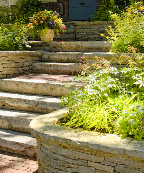 A set of stone steps leading to a blue door